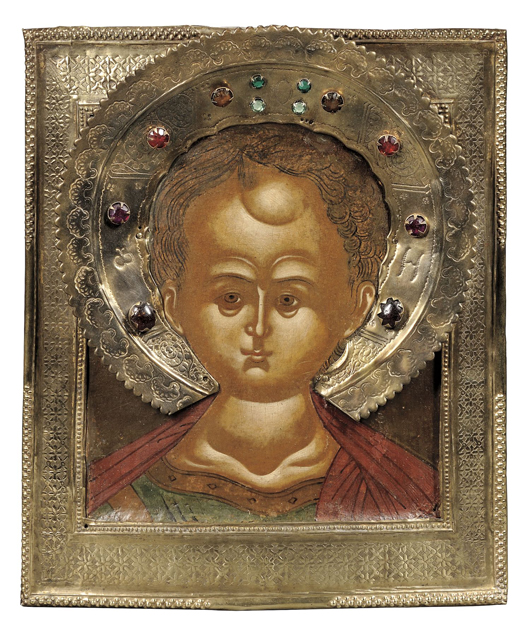 Russian icon of Christ Emmanuel, circa 1780, Christ as a youth surrounded by raised borders covered with a tooled and incised gilt brass basma. Estimate $2,000-$2,500. Estimate $2,000-$3,000. Image courtesy of Skinner Inc.